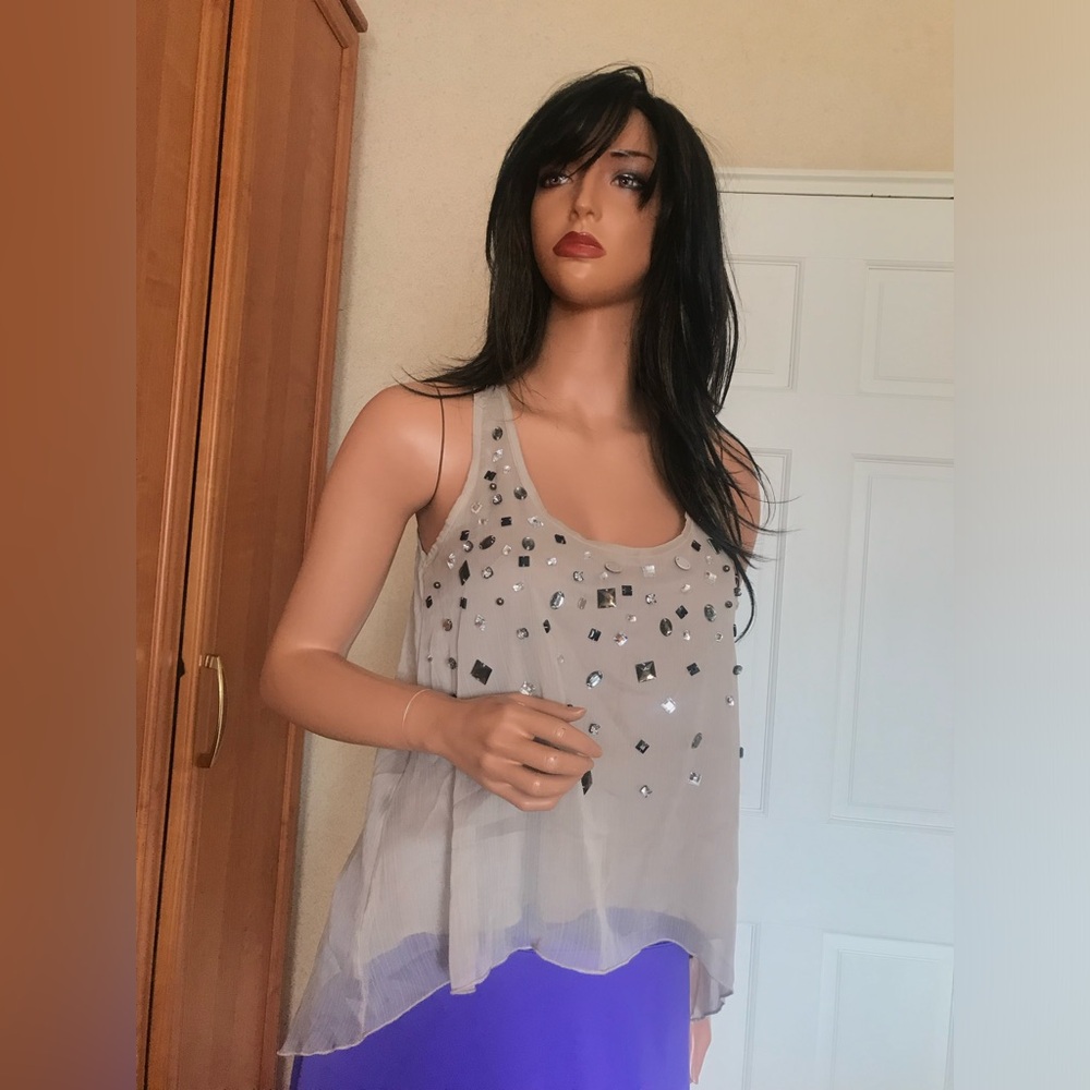 Ultra Pink see through top with gems detailing in latte color. Sz M gently used.